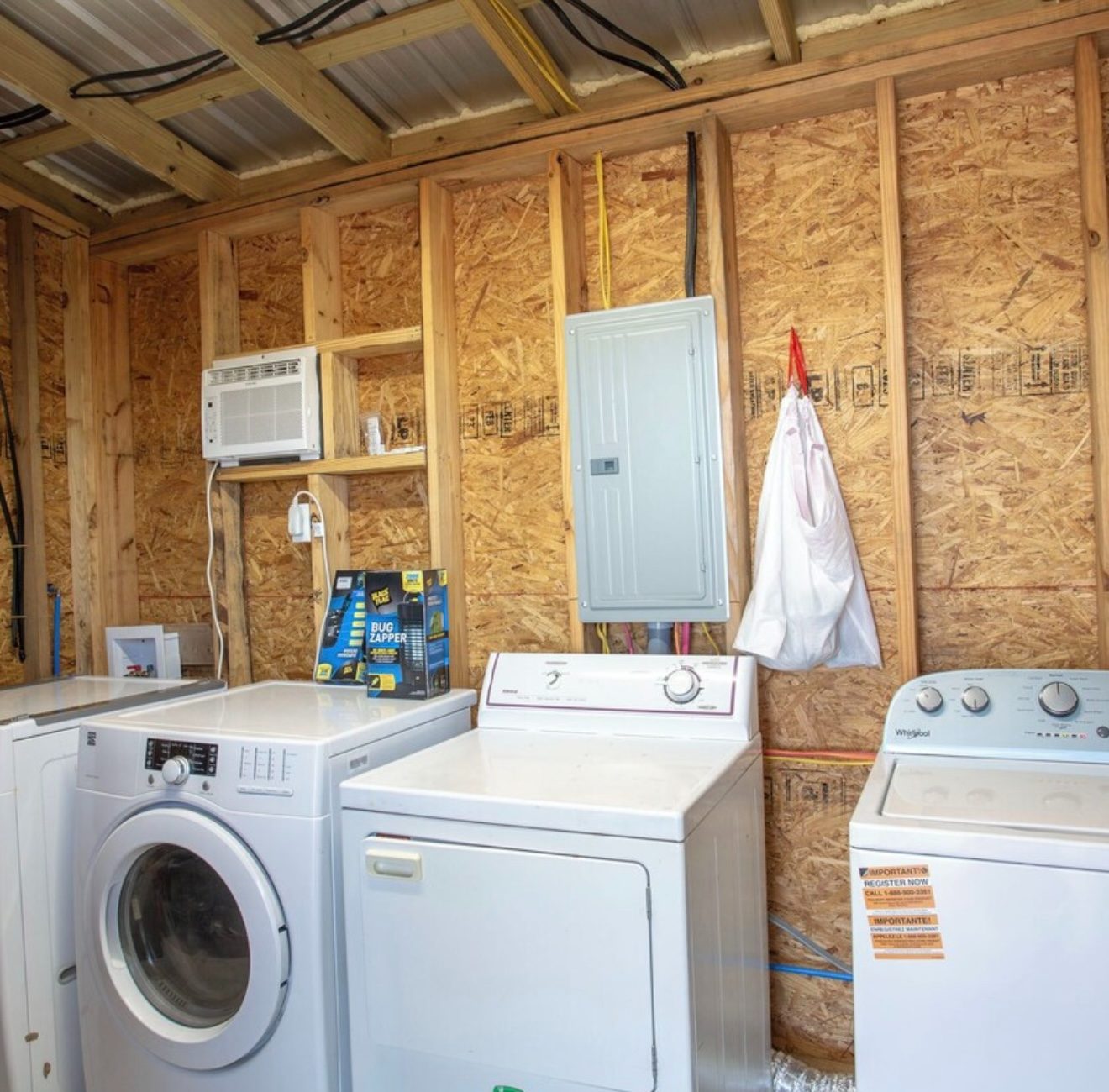 Shared laundry room with washers and dryers